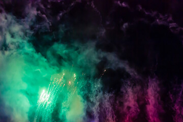 Night Fireworks Show With Bright Spark Trails And Smoke Illumination Against The Dark Sky