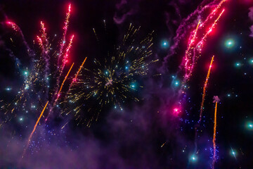 Night Fireworks Show With Bright Spark Trails And Smoke Illumination Against The Dark Sky