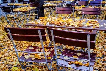 wooden benches and tables at a typical bavarian beergarden