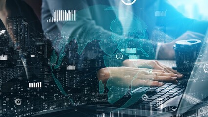 A close-up view of hands typing on a laptop, surrounded by digital analytics and global elements, emphasizing data-driven decision-making in a modern office. Xenic