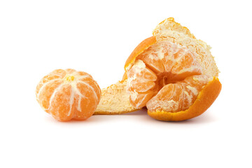 Whole and sliced tangerines with green leaf on black background mandarin orange