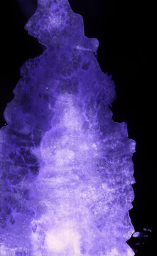 Bright painted neon blue and violet watercolor texture. Hand drawn background.