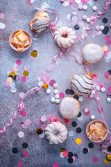 Colorful donuts, berliner and pastries for party and carnival