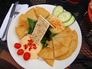 Hummus food plate pita bread cucumbers