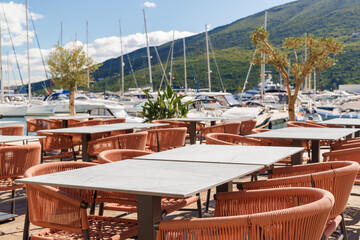 Cozy table on a Mediterranean restaurant terrace on a sunny day