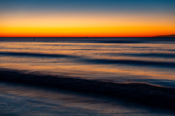 Fishing Boat on Horizon at Twilight