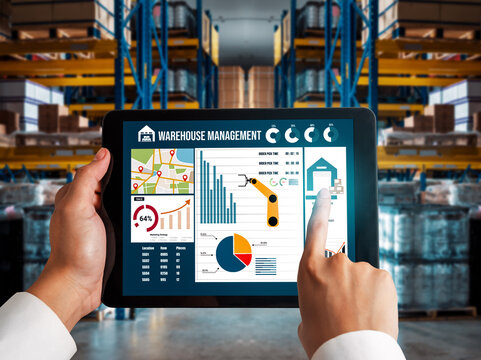 Warehouse management innovative software in computer for real time monitoring of goods package delivery . Computer screen showing smart inventory dashboard for storage and supply chain distribution .