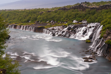view of the picturesque Hraunfossar cascades in western Iceland