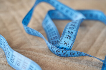 Mature Caucasian female extreme closeup wearing under eye patches showing natural skin texture aging and authentic selfcare skincare concept.