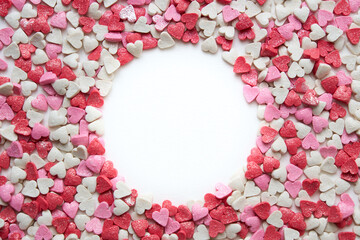 multi-colored hearts around a white circle