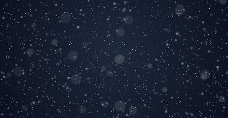 Heavy snow falling at night creating beautiful bokeh effect winter background design template © Suraj Das