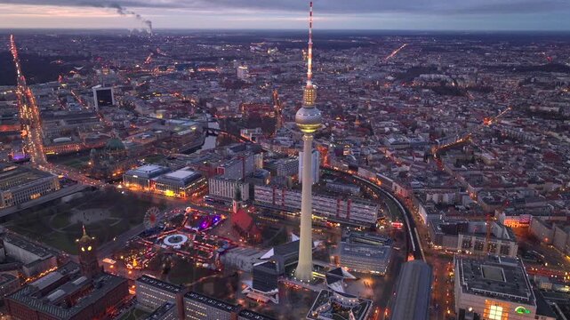 Christmas market in Berlin, Germany, Alexanderplatz at Evening Twilights, Aerial. Illuminated Weihnachtsmarkt, TV Tower
