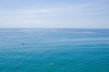 Obraz premium Tranquil Seascape with Boats and Clear Blue Water