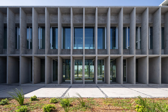 Modern brutalist concrete building on campus
