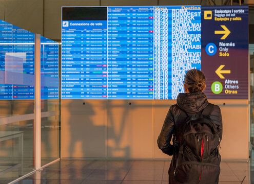 Woman waiting at airport in the morning