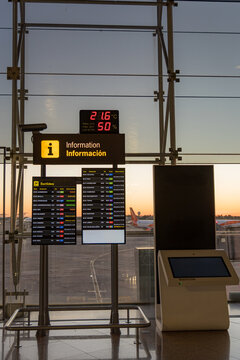Digital flight information display at airport during morning