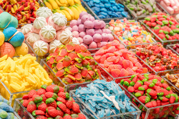 Colorful candy assortment in a vibrant market setting
