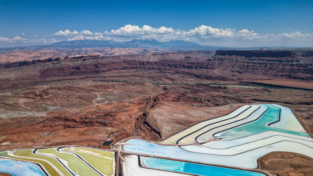 A large body of water with a blue section in the middle