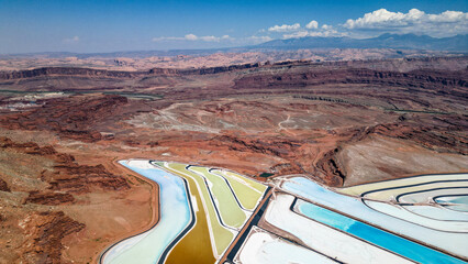 A large body of water with a blue section in the middle