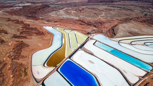 A large body of water with a blue section in the middle