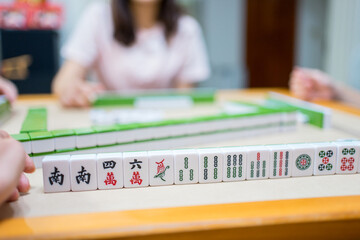 Mahjong game with friends at a table