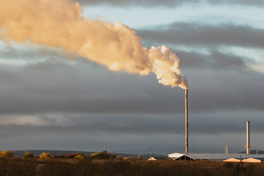 Smoke rising from industrial chimney in operation