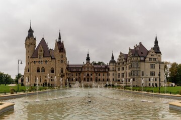 Obraz premium view of the fairy-tale Mozna Castle and fountains and gardens in southwestern Poland