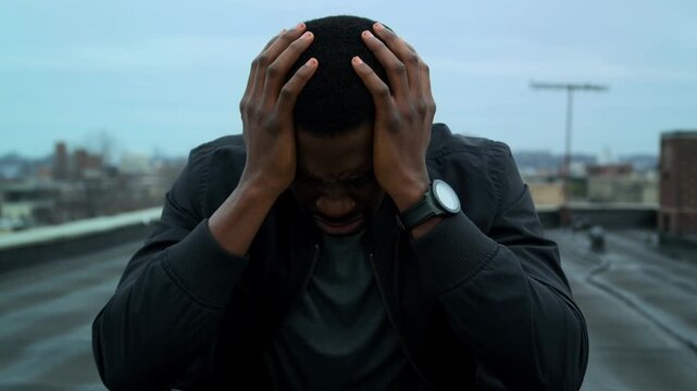 A person experiences frustration and holds head in anguish Stock Video