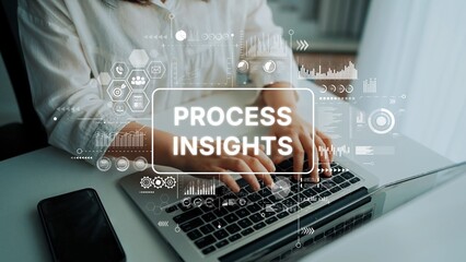 Business Analytics Concept with Text Process Insights Overlaid on a Person Typing on Laptop Keyboard in Modern Office Setting. Asymptotic smart data analytic.