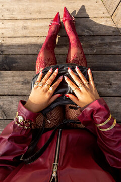 Stylish Gen Z woman with red fashionable accessories