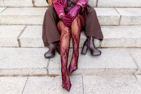 Sitting on steps with stylish urban fashion