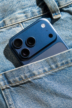 Smartphone in blue jeans pocket close-up