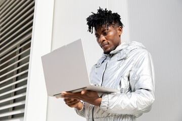 Man exploring technology on a laptop device