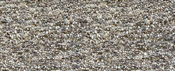 Pebbledash wall texture showing natural aggregate stones © Kornienko Alexandr
