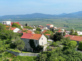 View of the town of Imotski and the karst plain of Imotsko polje in the background, Croatia - Pogled na grad Imotski i kr&scaron;ku nizinu Imotsko polje u pozadini, Hrvatska