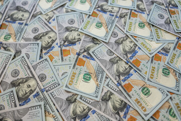 Fototapeta premium Pile of 100 hundred dollar bills background of success and money