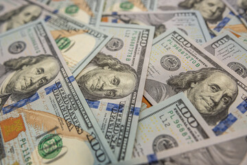 Pile of 100 hundred dollar bills background of success and money