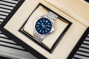 Elegant stainless steel watch for men with blue face, analog chronograph and fashionable style
