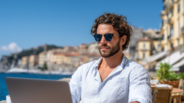 Digital Nomad Working at Outdoor Caf&eacute; Overlooking Mediterranean City, Travel Hero Image