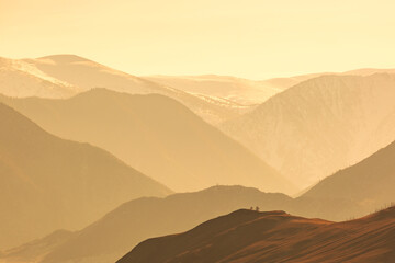 Colorful sunset over the mountain peaks. Altai, Russia