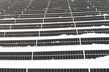 Renewable energy concept. Aerial drone view of solar panels power plant in winter, Norway