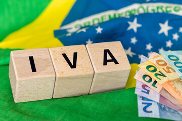  IVA, symbol for value added tax, Brazilian Portuguese written in on wooden dice. Financial and business concept. Close up