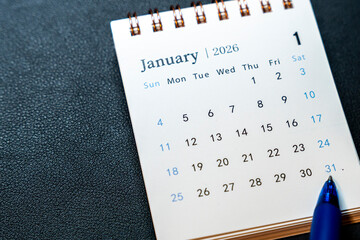 A detailed calendar page showing January 2026, with specifically highlighted dates and a blue pen marking January 31. This image suggests organization and planning for the year ahead.