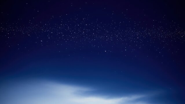 Christmas Deep blue night sky with faint stars and fading horizon light