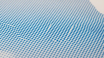 blue halftone dot pattern texture, minimalist geometric background with retro printing effect for modern design projects

