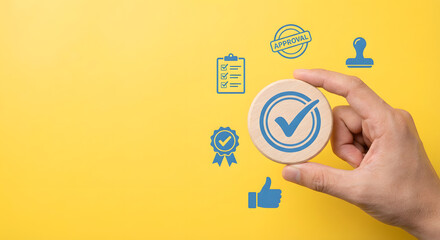 Business Approval and Certification Concept with Hand Holding Checkmark Icon on Bright Yellow Background