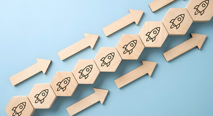 Progression of Rocket Icons on Wooden Hexagonal Blocks Showing Growth and Innovation