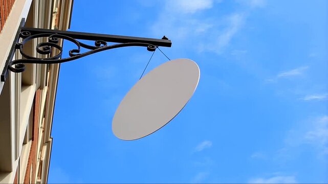 Blank White Circular Shop Sign Swinging in Wind Mockup against Blue Sky
