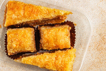 Baklava with pistachios and almonds dessert oriental sweets natural product tasty snack fresh delicious gourmet food background on the table rustic top view copy space