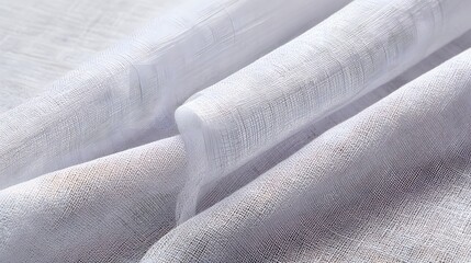 Layered white linen fabric texture with sharp weave details, folded cheesecloth material for textile backgrounds.